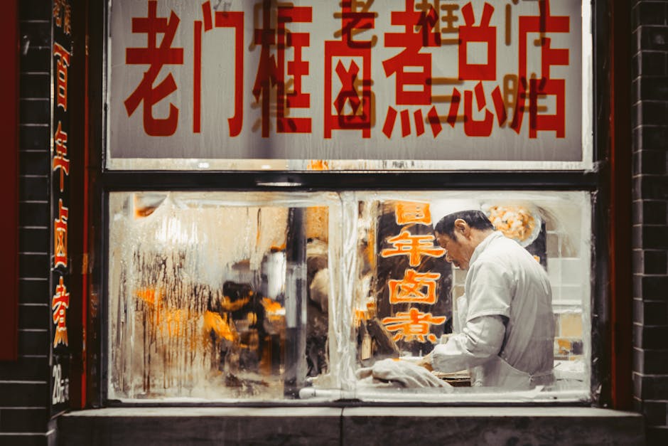Chef working in a traditional Beijing restaurant kitchen, showcasing authentic Chinese cuisine
