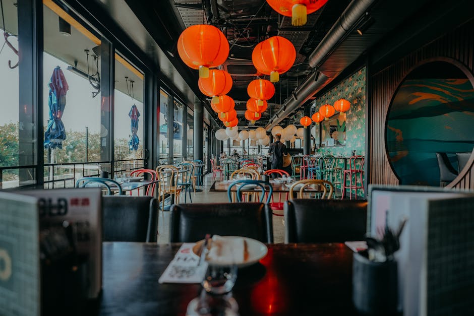 Modern Asian restaurant interior featuring colorful lanterns and vibrant decor.