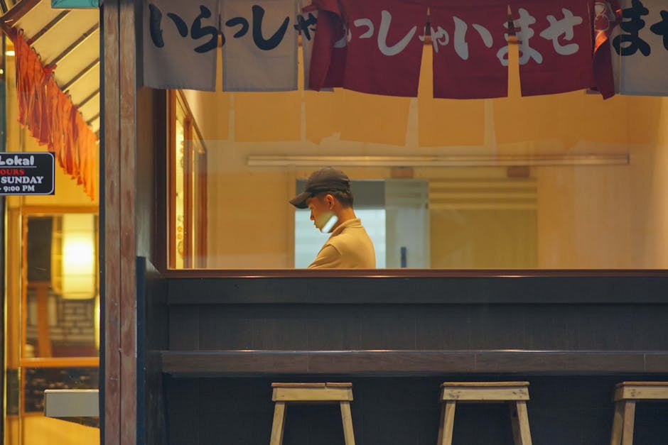 A chef works inside a Japanese restaurant in the Philippines, showcasing a traditional setting.